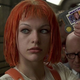 Leeloo holding up a multipass.